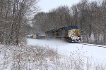 Climbing away from the Kalamazoo River, CSX 541 leads Q327 through the snow covered landscape